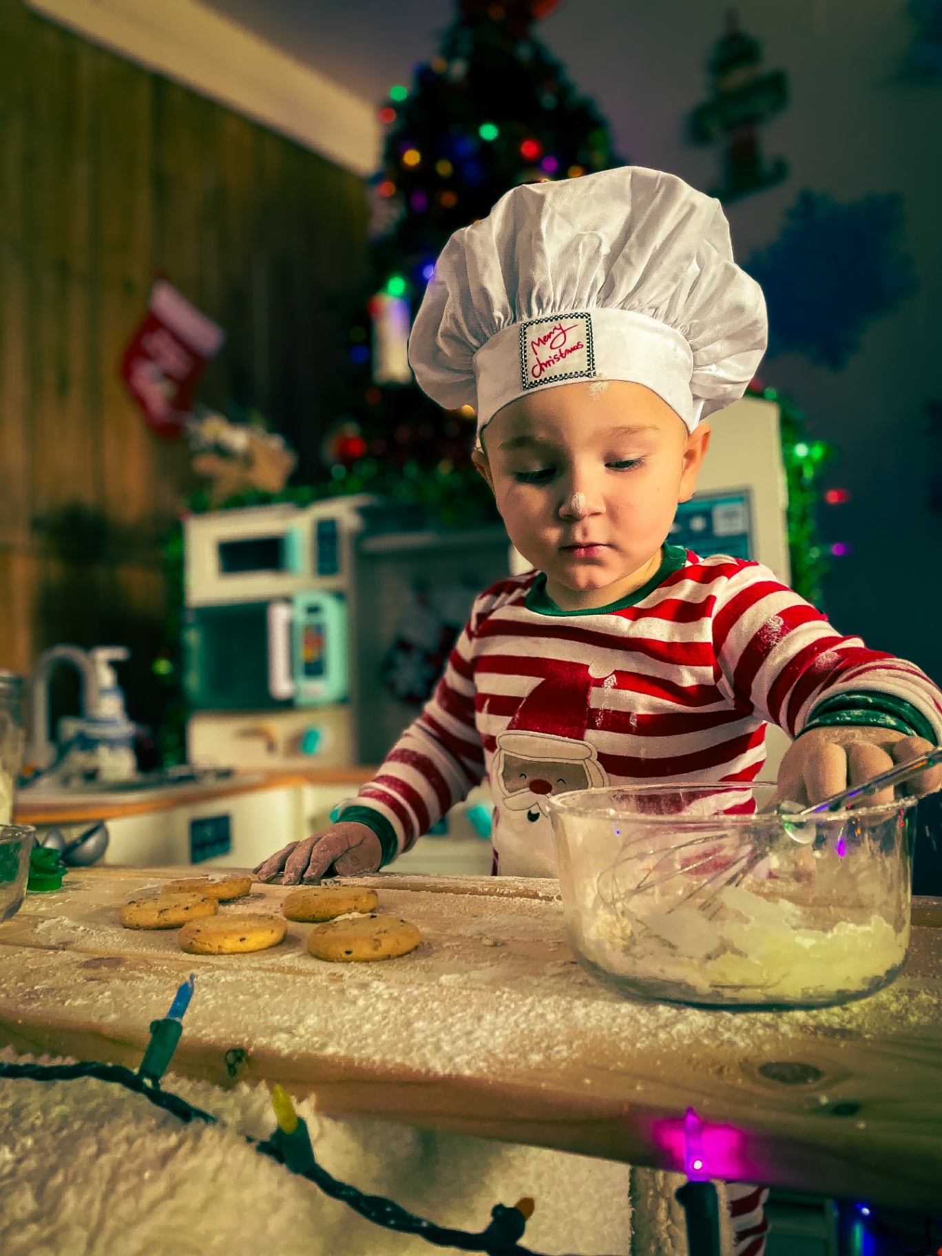 Holiday portrait of a child baking cookies