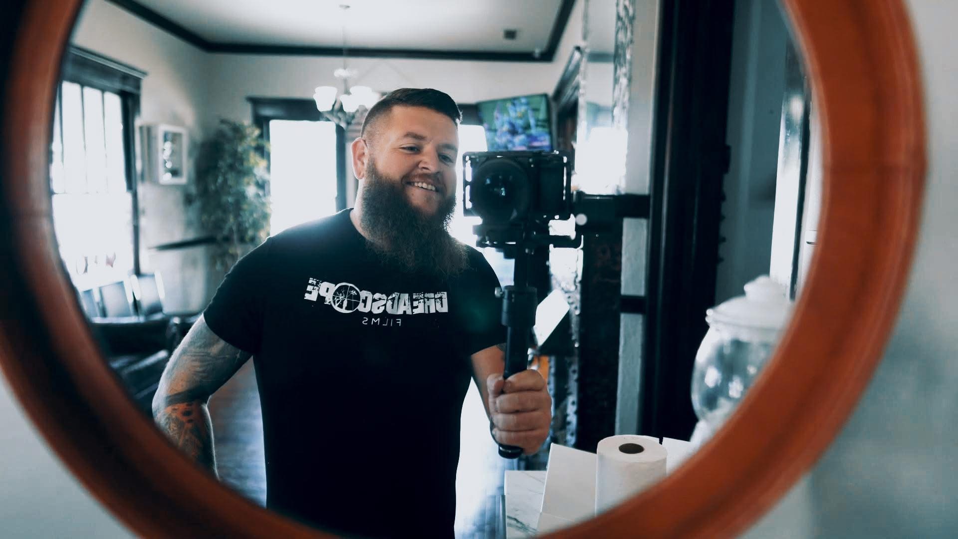 Justin filming with a gimbal-stabilized cinema camera